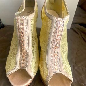 Cream colored, bedazzled peep-toed heels